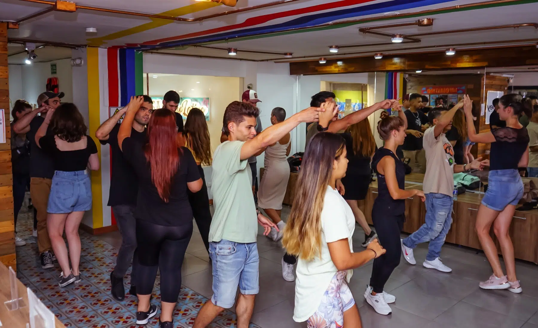 Students dancing salsa together at Casa Ritmo Latino in Laureles, Medellín